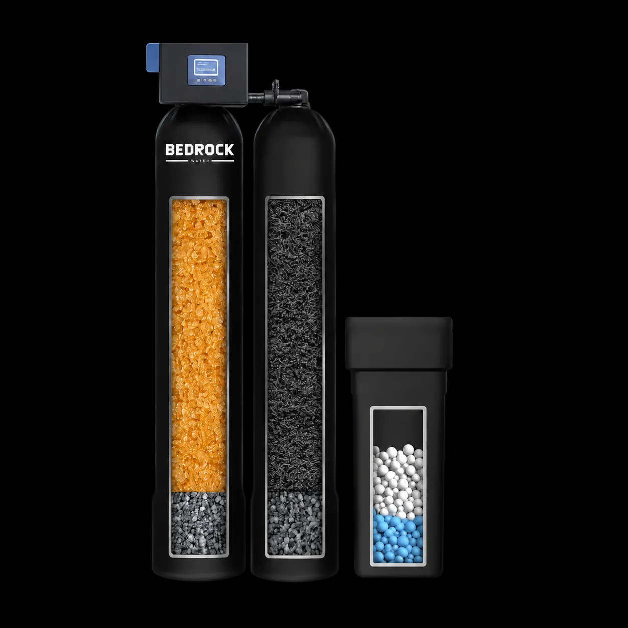 Two tall black tanks joined at the top by a digital valve, one holding amber resin and one dark carbon, with a smaller third tank of white and blue beads beside them.
