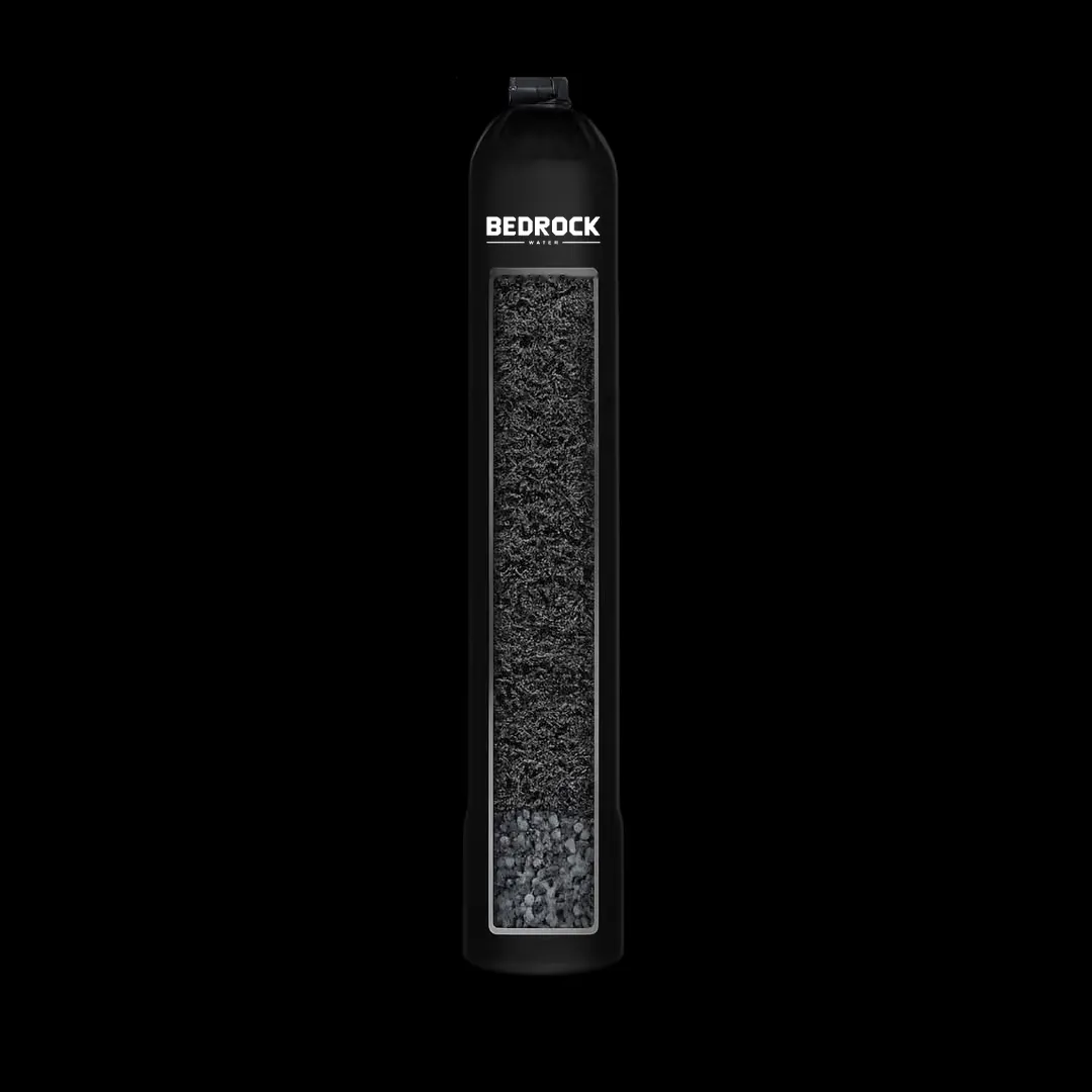 A single tall black tank with dark media visible through a narrow window, and no salt tank beside it.