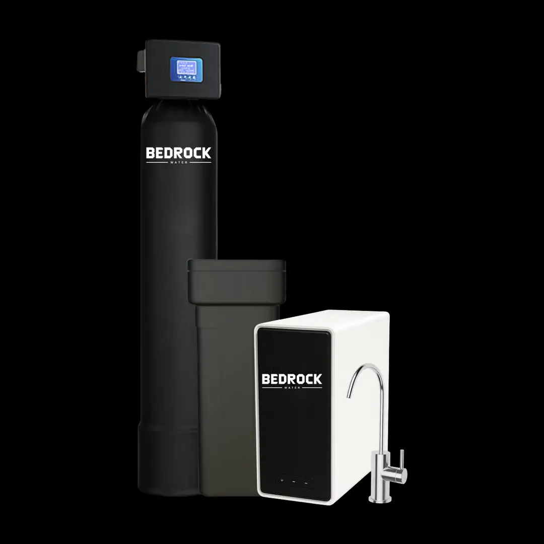A tall black tank with a digital valve on top, a square salt tank behind it, and a slim under-sink unit with its own chrome faucet.